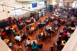 KOLKATA, INDIA - JAN 18, 2016: Visitors of popular Indian Coffee House have lunch on January 18, 2016 in Kolkata India. The India Coffee House chain was started by the Coffee Cess Committee in 1936 in Bombay